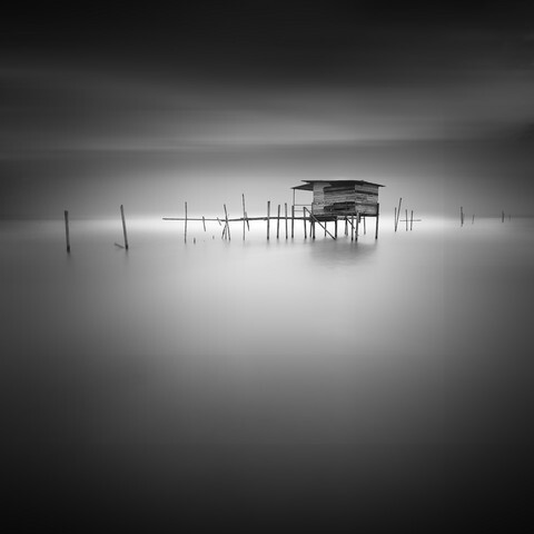 Black and white image of Langgai , the traditional fishing medium in Malaysia